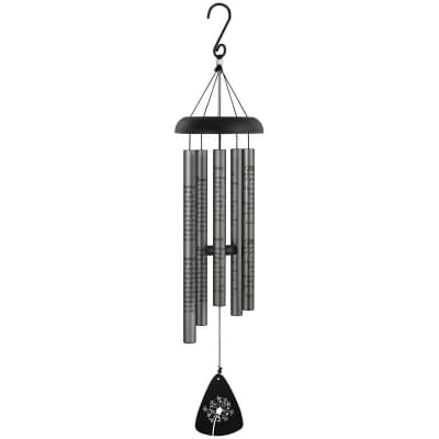 Black and silver metal wind chime with engraved text and floral design on the bottom sail