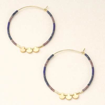 Pair of gold and beaded hoop earrings with blue and mauve accents