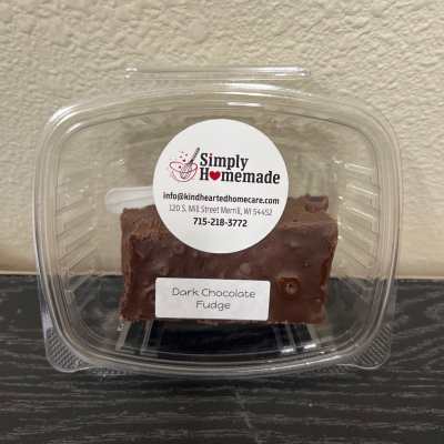 Container of dark chocolate fudge with a label