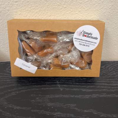 Box of caramel candies in clear plastic wrapping