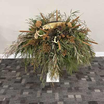 Large rustic arrangement with a fish centerpiece and cattails