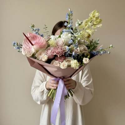 Large pastel bouquet with pink, white, blue, and yellow flowers
