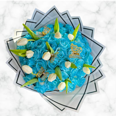 Blue rose bouquet with white tulips and butterfly accents