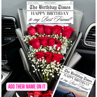 Bouquet of red roses with baby's breath and a birthday card