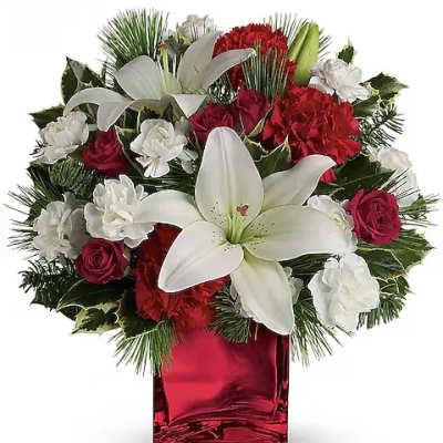 Red and white floral arrangement in a red glass vase