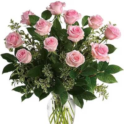 Pink roses arranged in a clear glass vase