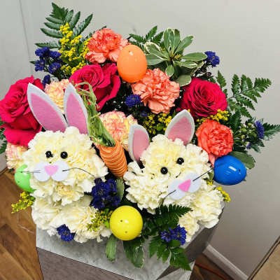 Colorful bouquet with roses, carnations, and bunny decorations