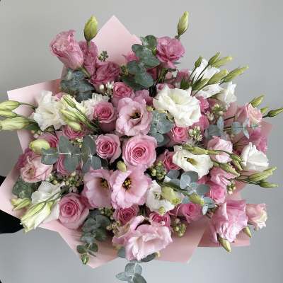 Pink and white bouquet of roses and lisianthus with eucalyptus