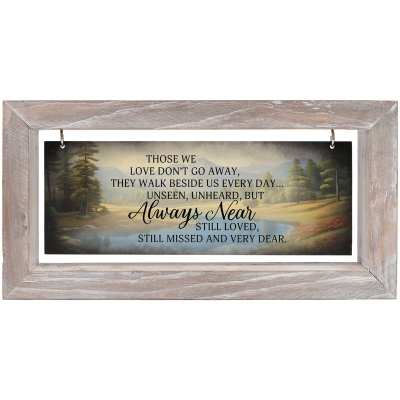 Rectangular wooden-framed wall sign with landscape artwork and memorial quote in script lettering