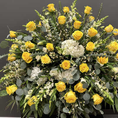 Large yellow rose and white hydrangea arrangement with eucalyptus