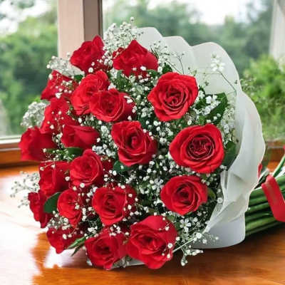 Bouquet of red roses with baby's breath wrapped in white paper