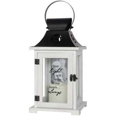 White wooden memorial lantern with black metal top, glass door, and pillar candle inside