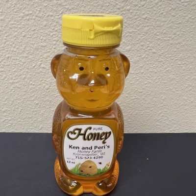Bear-shaped honey bottle with a yellow cap