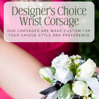 White wrist corsage with small roses and ribbon