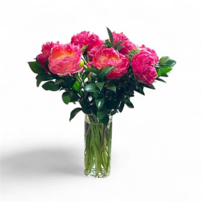 Pink peonies arranged in a clear glass vase