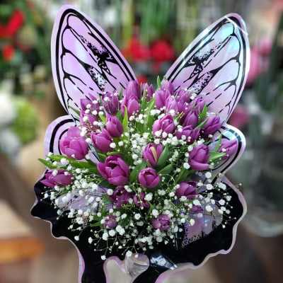 Purple tulip bouquet with white baby's breath and butterfly wings