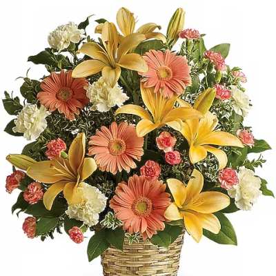 Basket arrangement with yellow lilies, peach gerbera daisies, and carnations
