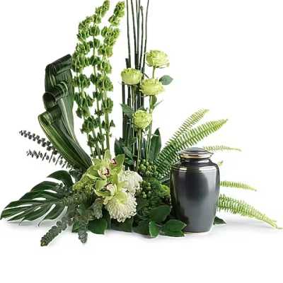 Green floral funeral urn arrangement with orchids and ferns