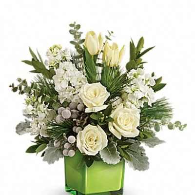 White roses and tulips in a green square vase