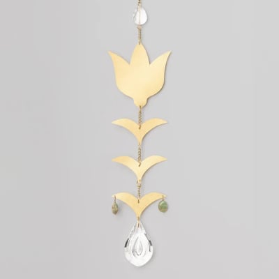 Gold metal floral-inspired hanging ornament with clear teardrop crystal and green beads