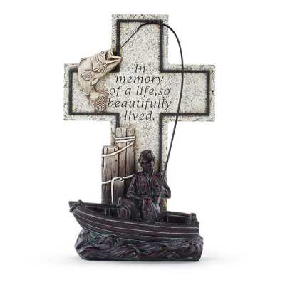 Memorial cross figurine with a fisherman in a boat and a leaping fish on a line