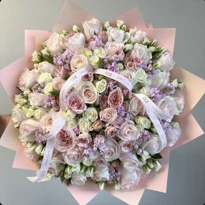 Large bouquet of pale pink and white roses with lavender accents