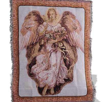 Angel illustration on a fringed woven blanket with a floral bouquet