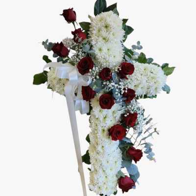 Red roses cross funeral arrangement