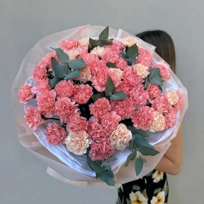 Large bouquet of pink and cream carnations with eucalyptus