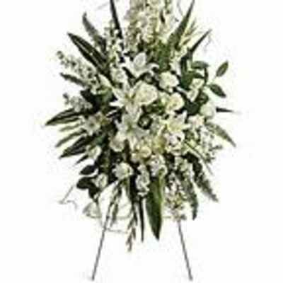 Tall white floral standing spray on an easel