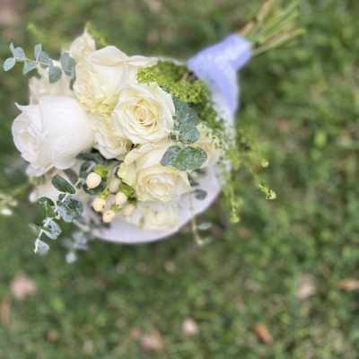 White rose bouquet with eucalyptus and small berries