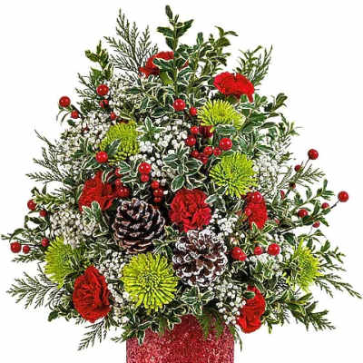 Christmas arrangement with red flowers, green blooms, berries, and pinecones in a red glitter vase