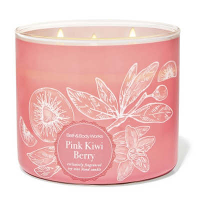 Pink scented candle in a glass jar with three wicks