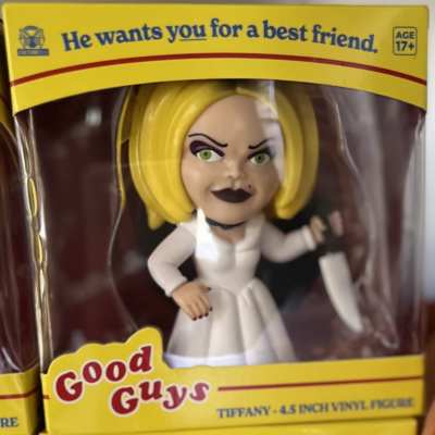 Boxed vinyl figurine of a blonde woman in a white dress