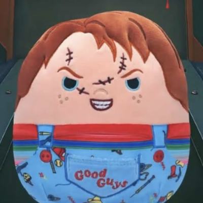 Decorative cake shaped like Chucky in overalls