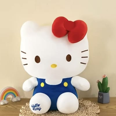 Hello Kitty plush figure with a rainbow ornament and small potted cactus