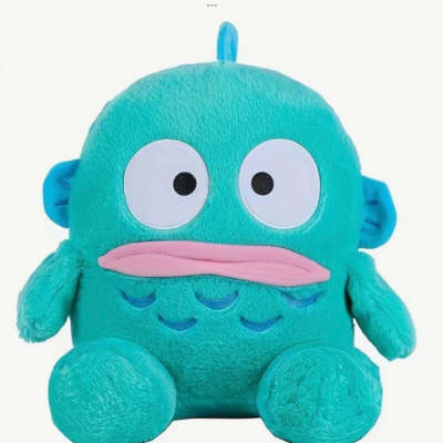 Teal plush monster toy with big eyes and pink mouth