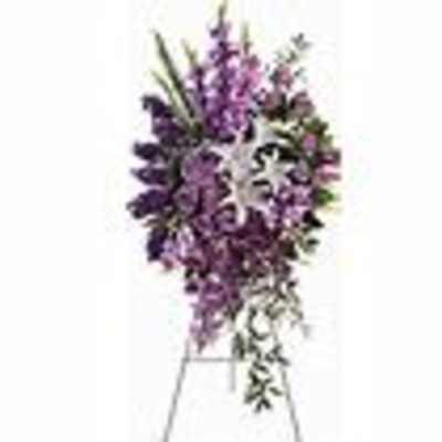 Purple floral arrangement in a clear vase