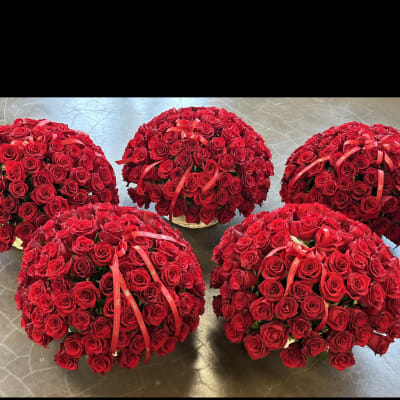 Five dome-shaped bouquets of red roses with ribbon accents