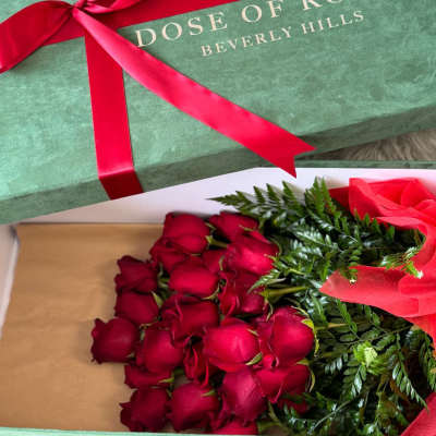 Box of red roses tied with a red ribbon