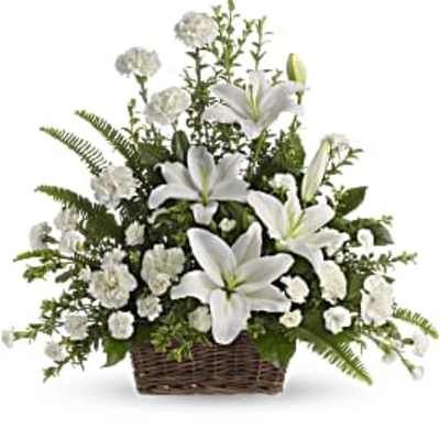 White lilies and carnations in a wicker basket