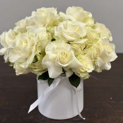 White rose bouquet in a white round box with ribbon