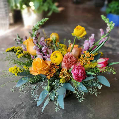Mixed bouquet with yellow and pink flowers in a low arrangement