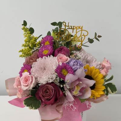 Mixed bouquet in a white hatbox with a gold Happy Birthday topper