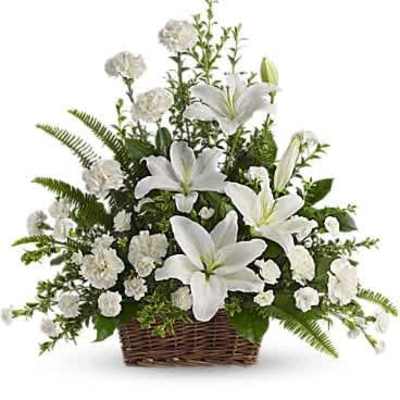 Basket arrangement of white lilies and white carnations