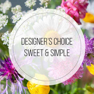 Designer’s choice floral arrangement with white daisy and purple blooms