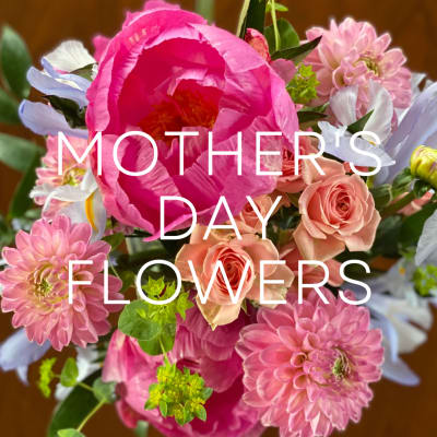 Pink peonies, roses, and dahlias in a mixed bouquet