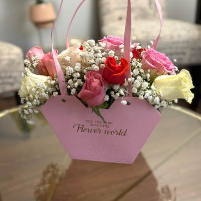 Pink gift bag with roses and baby's breath