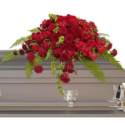Red rose casket spray with fern accents
