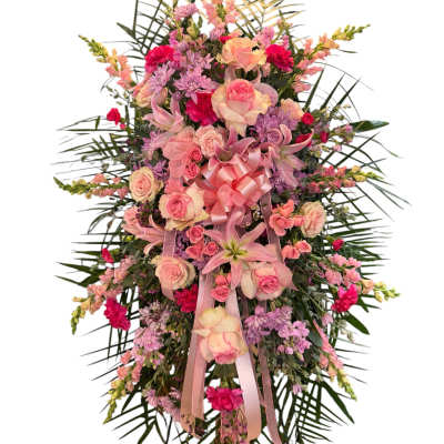 Large pink and lavender floral standing spray with ribbon